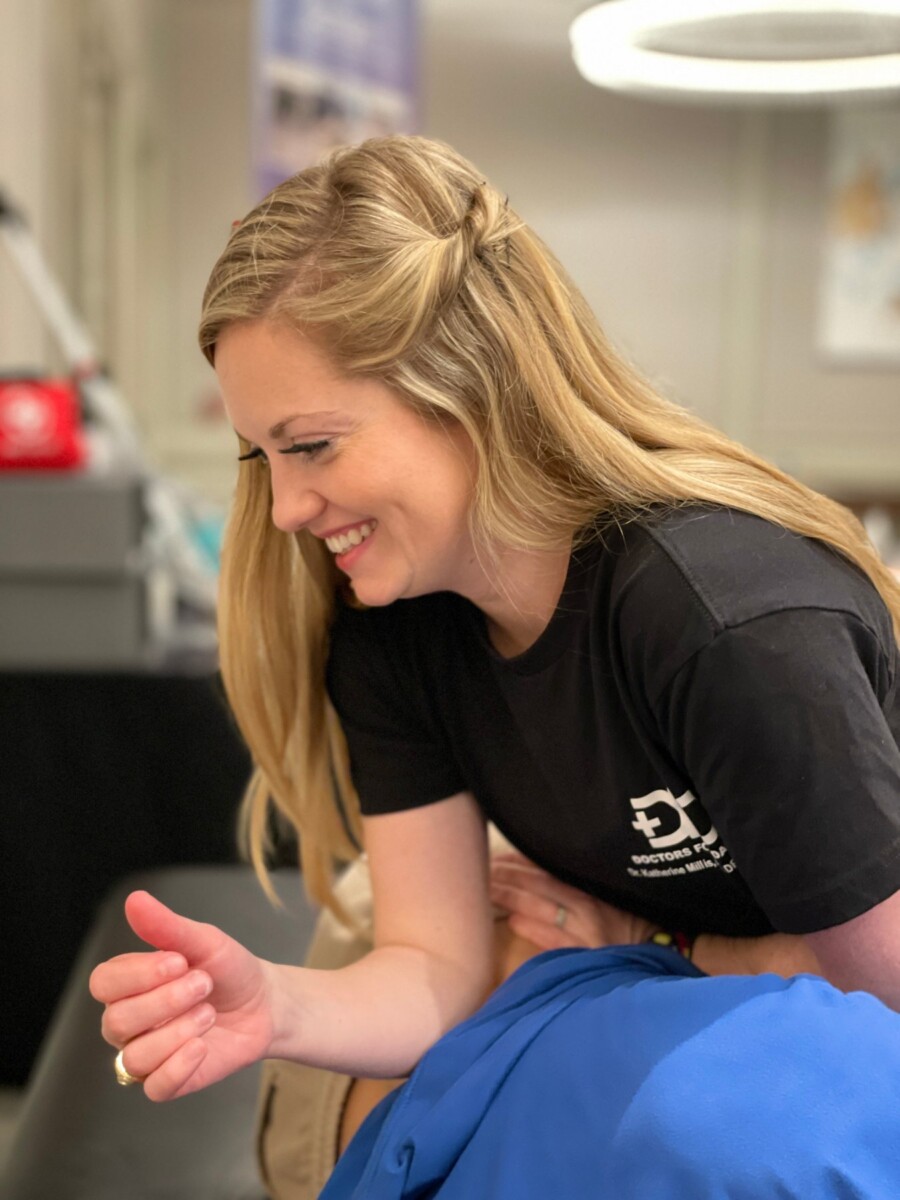 DFD Dance Specialist Dr. Katherine Millis working with a dancer