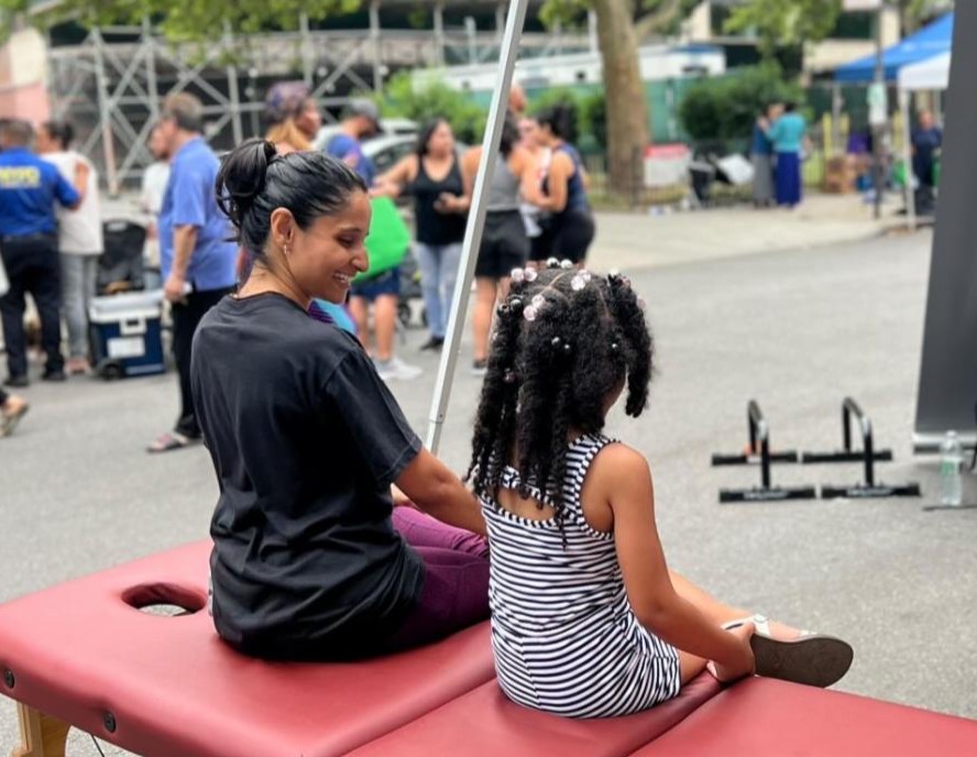 DFD Dance Specialist Dr. Foram Patel with a young dancer at the KR3TS Wellness Dance Festival in New York